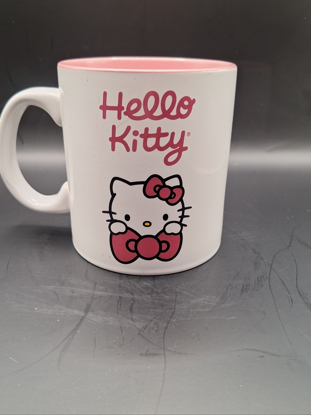 The Hello Kitty White & Pink coffee mug tea cup is a collectible